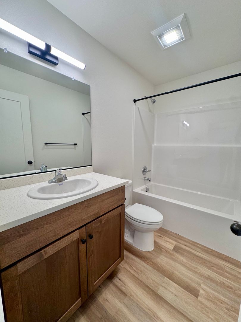 Full bathroom with tub shower and vanity